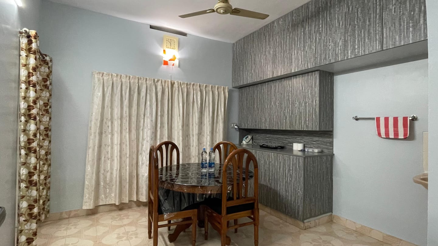 Dining area with round table and four chairs